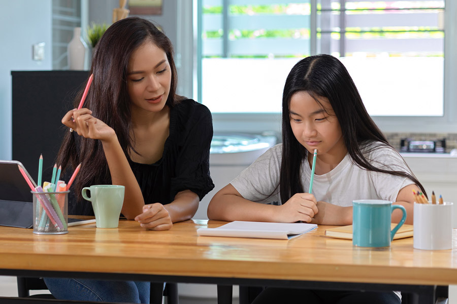 student and tutor together at a desk in San Diego